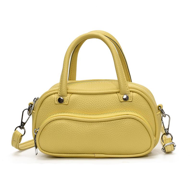 Korean version of trendy simple lychee pattern cream portable pillow bag women's leisure commuting versatile high-end messenger bag