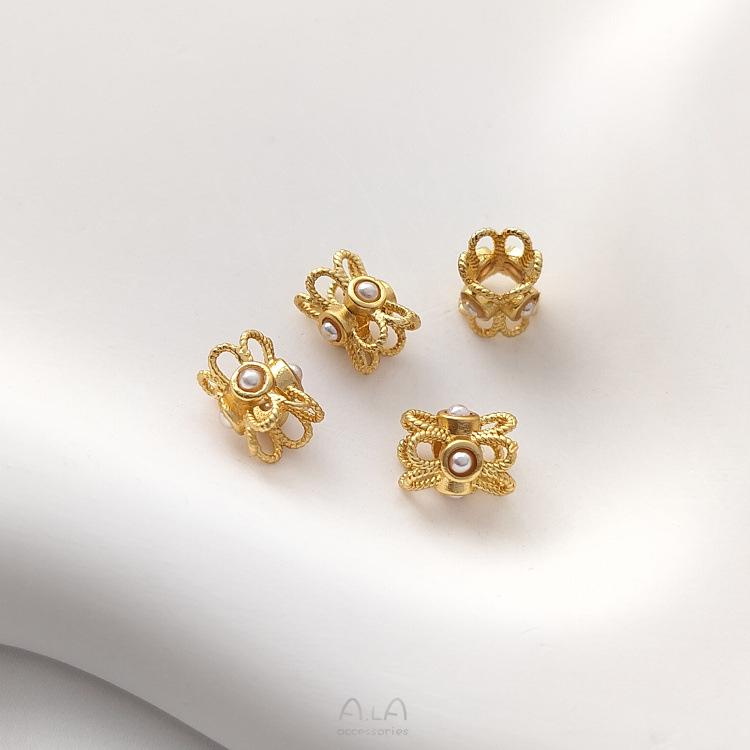 Color-preserving copper-plated matte gold flower-shaped spacer beads with imitation pearl inlay for DIY jewelry.