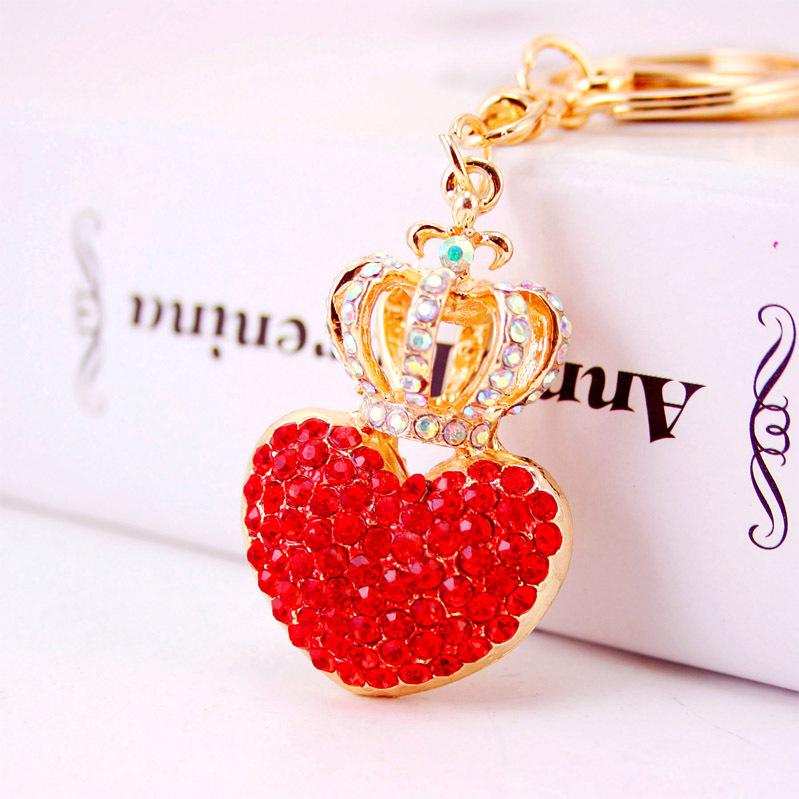 Elegant Diamond-Studded Four-Leaf Clover Keychain: Perfume Bottle Bag Charm for Women
