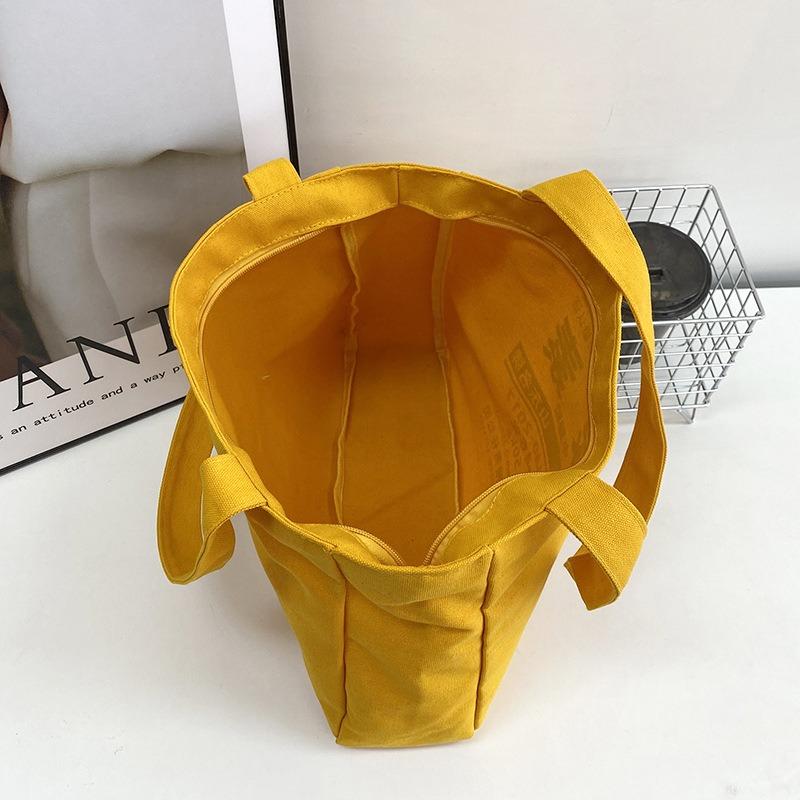 Literature and art large-capacity casual versatile canvas bag women's new shoulder class commuter tote bag tote bag