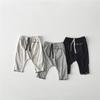 Unisex Autumn Baggy Pants for Kids with Pockets, Ribbed Texture, Ruffle Hem, and Roomy Fit