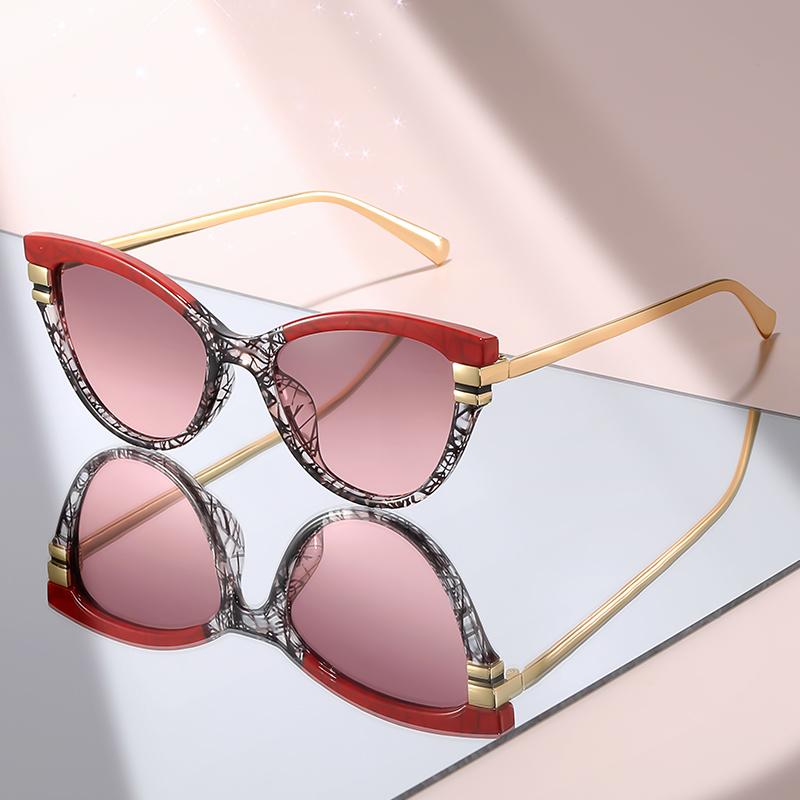 Fashion Cat Eye Sunglasses with Black Top Frame, Red Patterned Lower Frame, Gold Metal Arms, and Gradient Brown Lenses For