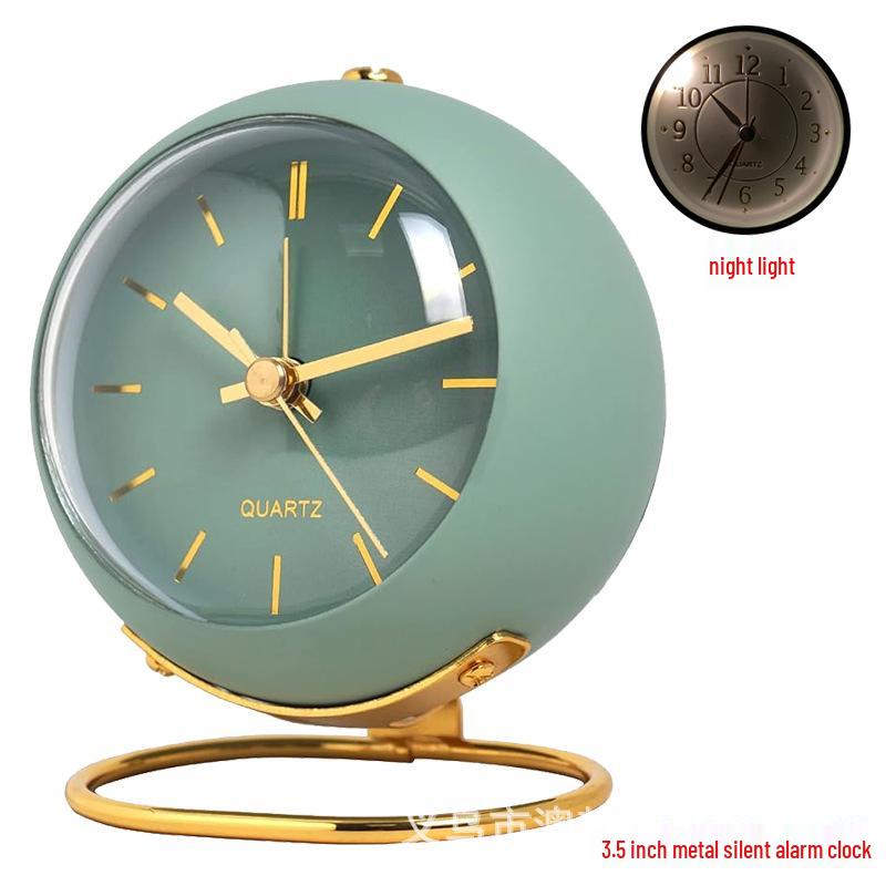 Silent Metal Alarm Clock with Night Light and Gold Stamped Spherical Face - Perfect for Students and Children.