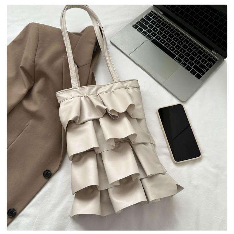 Neue Handtaschen sind trendige, einfarbige, personalisierte Plissee-Schultertaschen, modische und vielseitige Eimertaschen mit großem Fassungsvermögen.