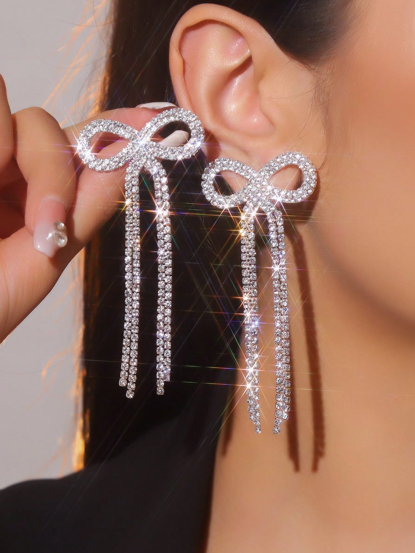 

A pair of vintage-style, ornate, long crystal earrings in the shape of a bow. Perfect for Valentine s Day, Mother s Day, or everyday wear.