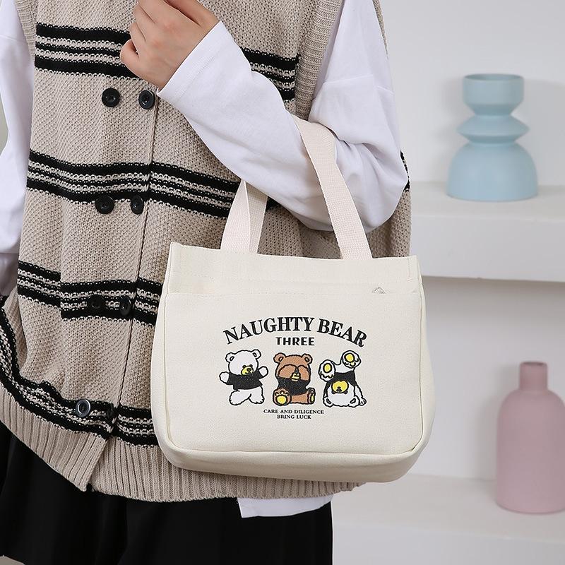 Cartoon cute canvas bag, women's bag, Bao Ma going out simple hand bag, bento office worker handbag