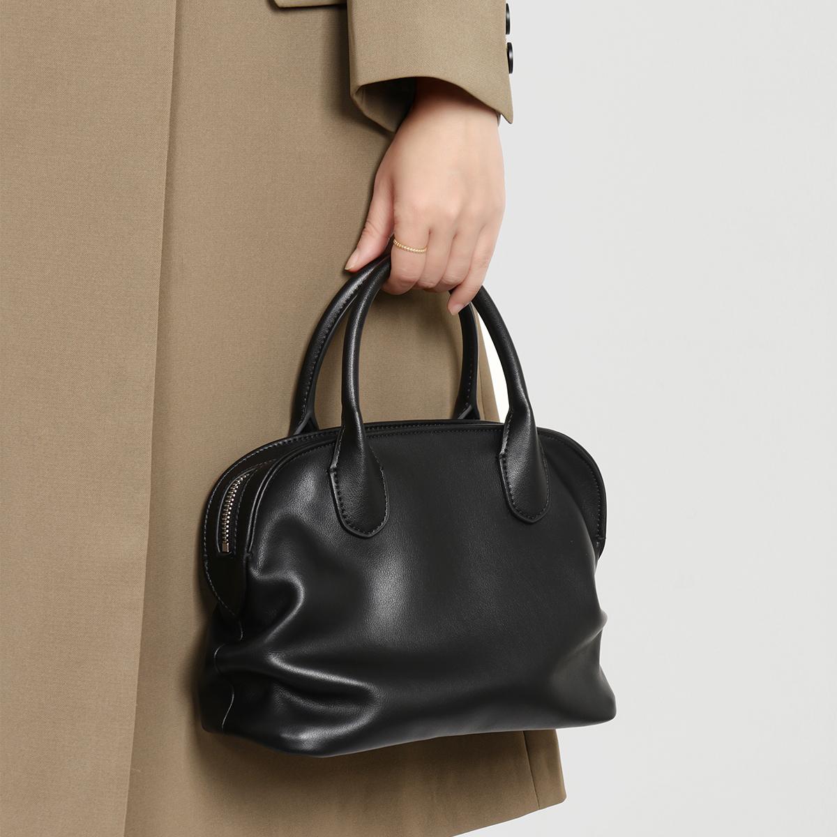 Женская сумка из натуральной кожи трансграничная новая простая сумка-ракушка высококачественная нишевая дизайнерская сумка-тоут для commuters сумка-боулинг чёрный 8870₽