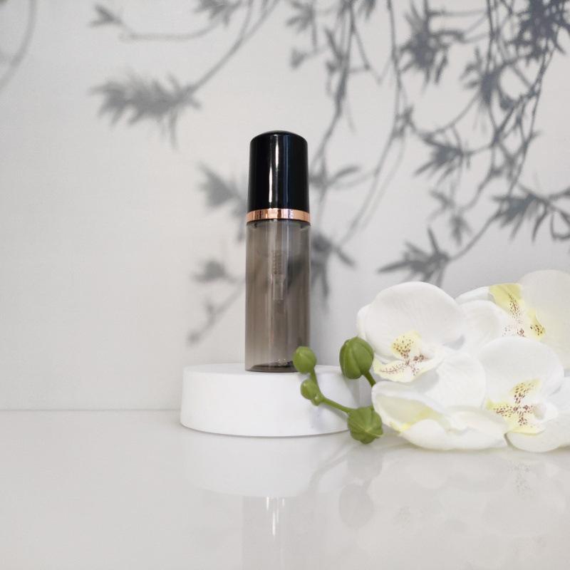 Available 60ml Transparent Black Foam Mousse Bottle for Face Wash and Travel-friendly Cosmetic Packaging.