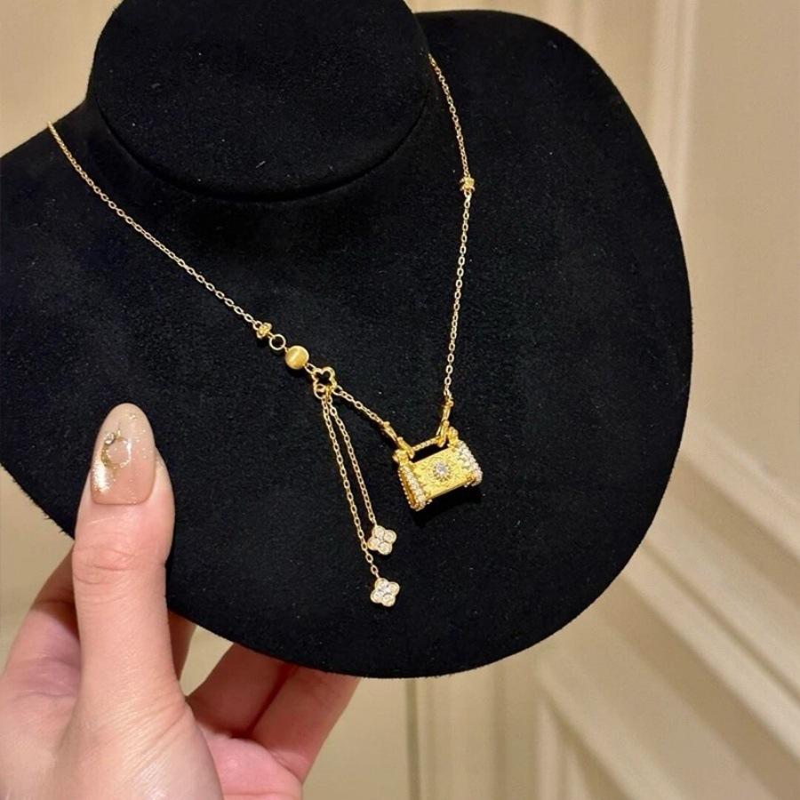 

Medieval brushed zircon lock bag four-leaf clover necklace light luxury fringed collarbone chain niche neck chain