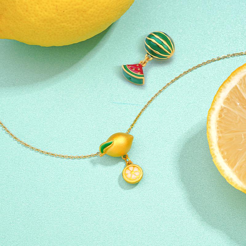 Pozłacana bransoletka damska z zawieszką cytryny i arbuza oraz naszyjnik z koralikiem szczęścia