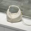 The new crescent-shaped bag, hand-held top layer cowhide women's bag, single-shoulder crossbody genuine leather underarm bag, exudes a sense of luxury