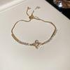 Zircon Heart Bow Pendant Bracelet: Stylish, Versatile Hand Jewelry with a Luxurious, High-End Feel.