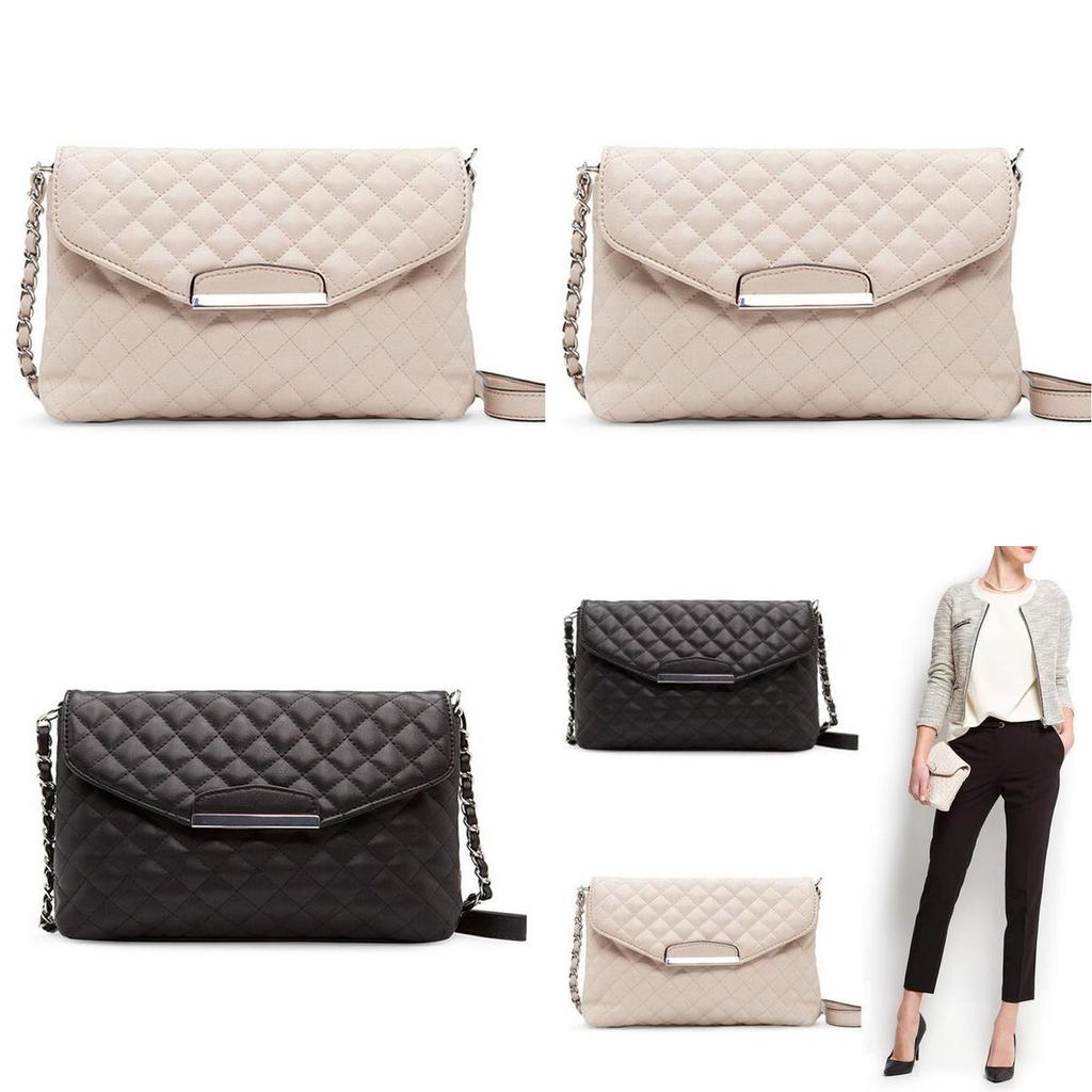 Versatile Women's Leather Clutch Handbag With Classic Appeal And Adjustable Strap