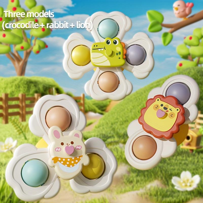 A Set of Three Cartoon Animal Suction Cup Spinning Tops for Babies, Designed To Enhance Hand-Eye Coordination During Early Education
