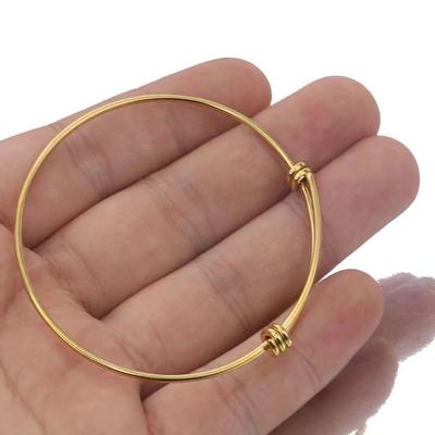 Rundes, verstellbares Spiralarmband aus Titanstahl mit elastischem Push-Pull-Design