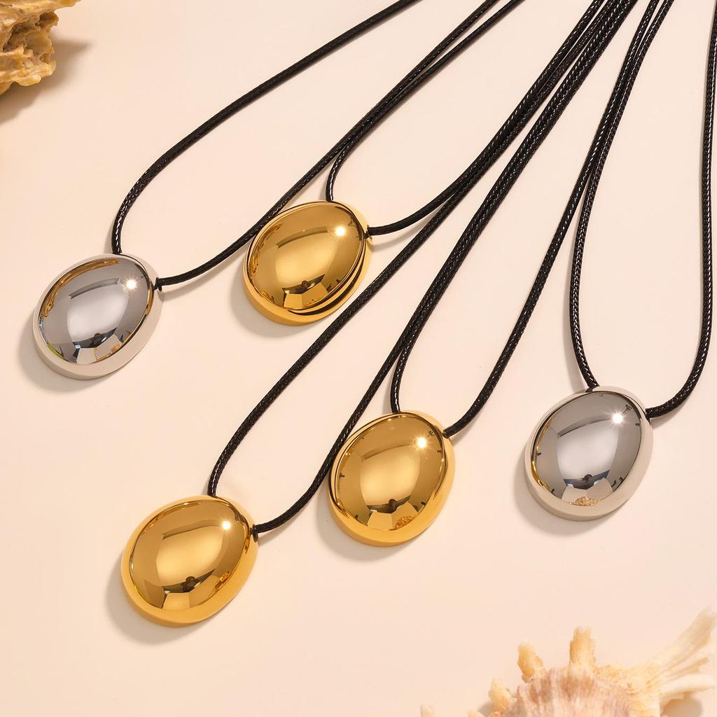 Oumika Geometric Pendant Necklace: High-Polished Stainless Steel with Black Cord, Clavicle-Length, Non-Fading, European & American Style.