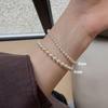 Elegant Multi-Piece Faux Pearl Bracelet for Women - Versatile, Elastic, and Stackable.