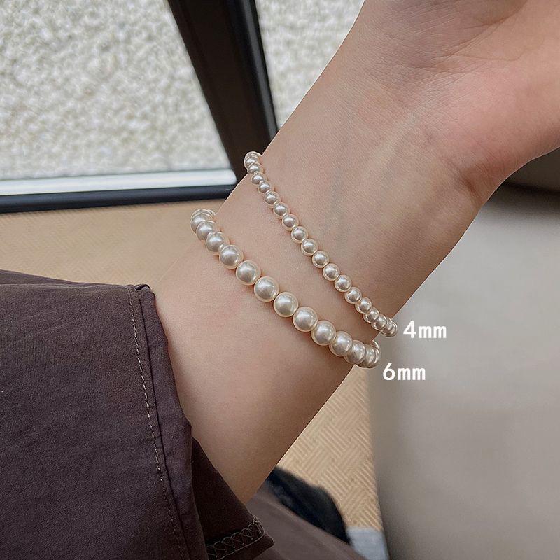 Elegant Multi-Piece Faux Pearl Bracelet for Women - Versatile, Elastic, and Stackable.