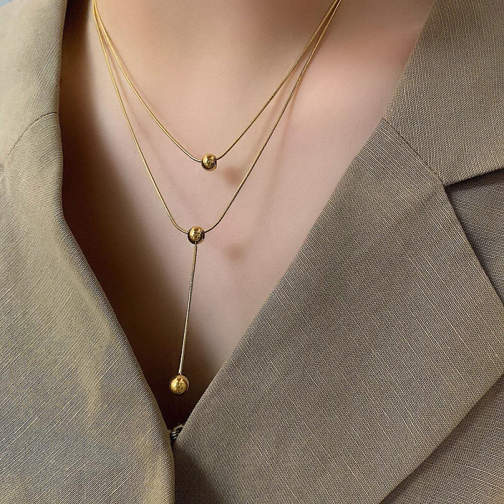 

Сохраняющее цвет легкое роскошное двухслойное ожерелье с круглыми бусинами и бахромой, женская модная универсальная высококачественная цепочка на ключицу золотой