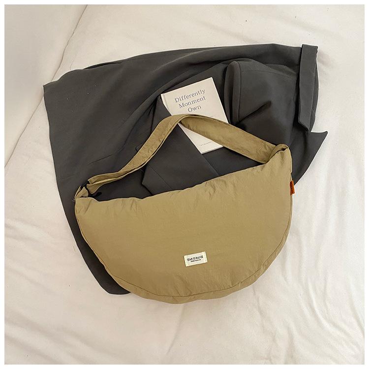 

Large capacity dumpling bag women 2025 new fashion versatile casual shoulder bag commuter student class messenger bag хаки
