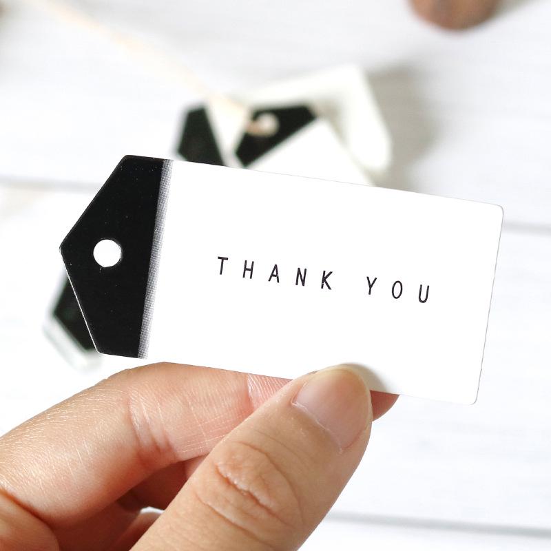 50 Černobílých šipkovitých ručně vyráběných visaček 'Děkuji' na balení pečiva