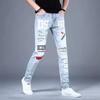 Men's Slim Light Blue European-Style Skinny Jeans with Korean Print, Perfect for Spring and Autumn.