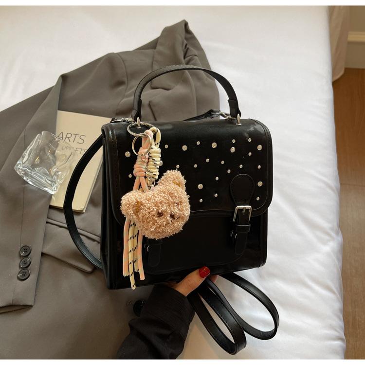 

2025 новый рюкзак женский модный повседневный портативный корейская версия студенческий школьный рюкзак трендовая милая многофункциональная сумка через плечо no pendant чёрный