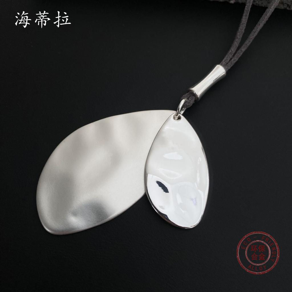 Irregular leaf alloy pendant, simple retro leather rope women's long high-end necklace