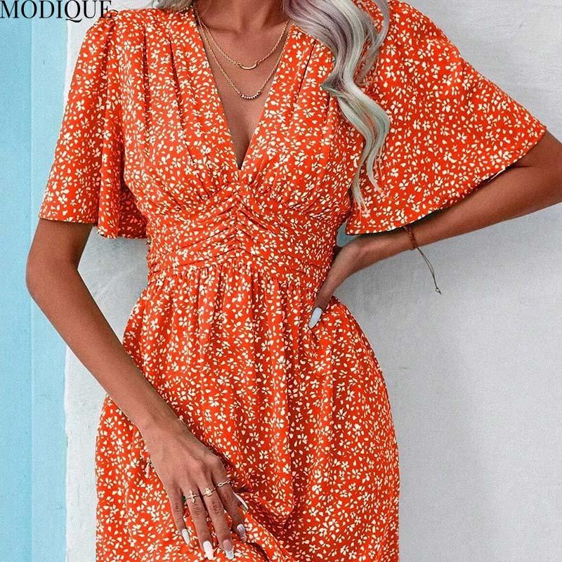 MODIQUE 2025 Summer New Women's Sexy Casual Floral Printing Ruffles Elastic Waist Short Dress Ladies X-Line Hot Batwing Sleeve V-Neck Dress