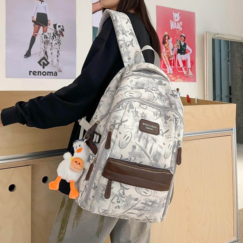 Schoolbag new graffiti niche schoolbag male junior high school student high school student lightweight backpack college student large capacity