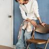 Guess Hyunjin wearing denim jeans & tarpaulin bag