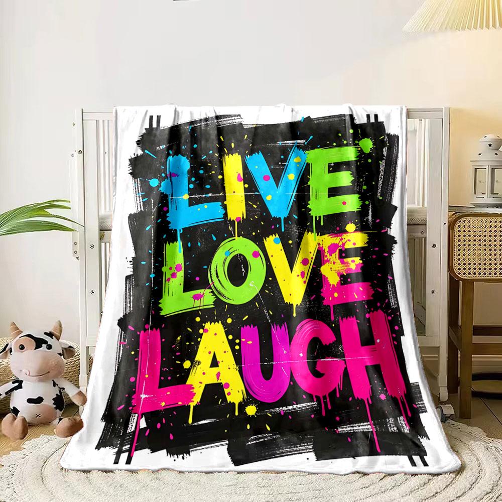 Bold neon text LIVE LOVE LAUGH on a black paint-splattered background. for all seasons blanket lunch break throw gift 80cm x 120cm
