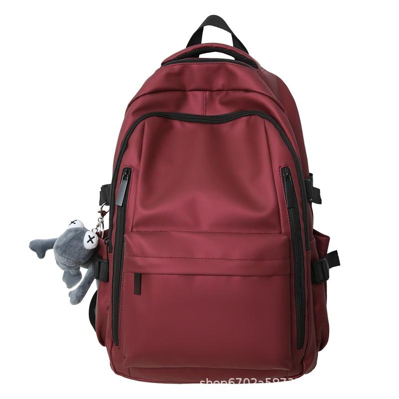 

Lightweight and versatile student schoolbag Female junior high school student High school student burden reduction backpack Couple leisure travel no pendant красный
