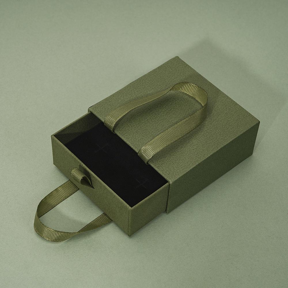 Compact Portable Jewelry Box for Rings, Necklaces, and Ear Studs - Simple Design, Ready for Gift-Giving.
