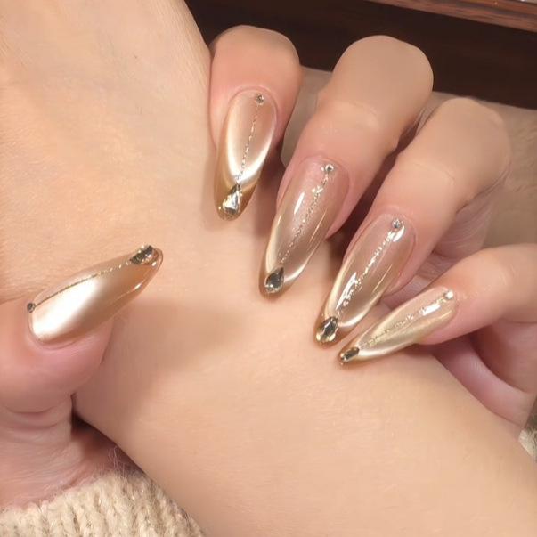 

Xiaohongshu Brown Long Cat Eye Nails with Sparkling Champagne Gold Diamonds XS