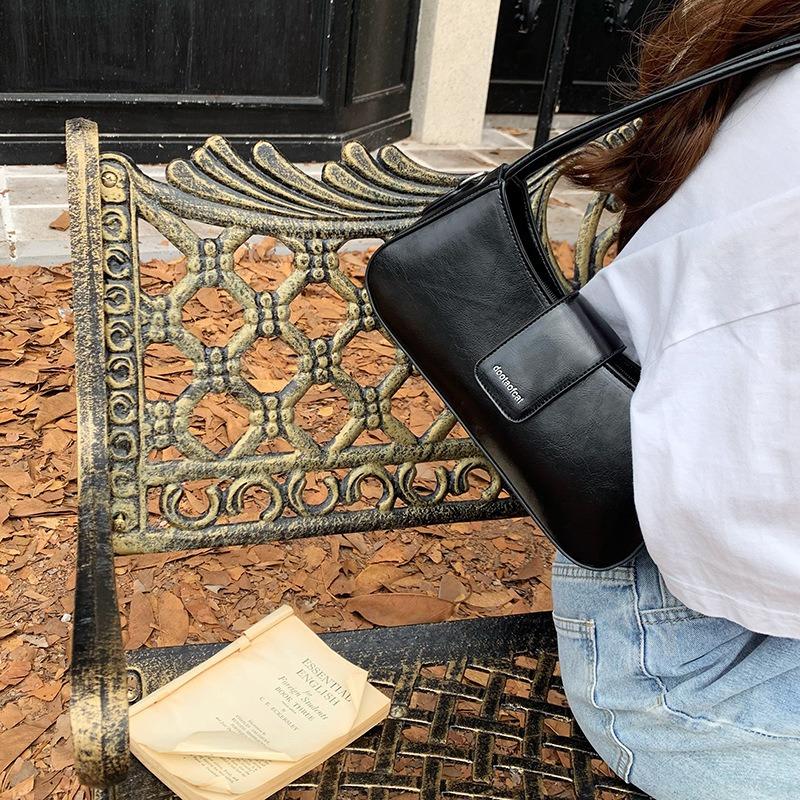 Texturierte Handtasche Nische Achseltasche neue Mode Pendler-Tasche Baguette-Tasche vielseitige Schulter-Umhängetasche