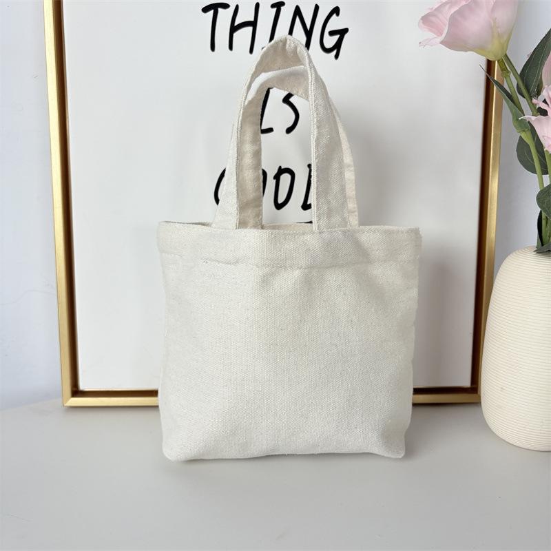 Effenkleurige eenvoudige lunchtas, draagbare canvas tas, kleine stoffen tas, draagbare canvas tas voor het opbergen van diverse spullen