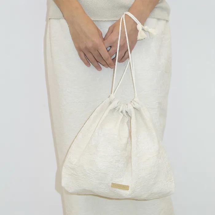 FLORAL-JACQUARD DRAWSTRING BAG - ECRU