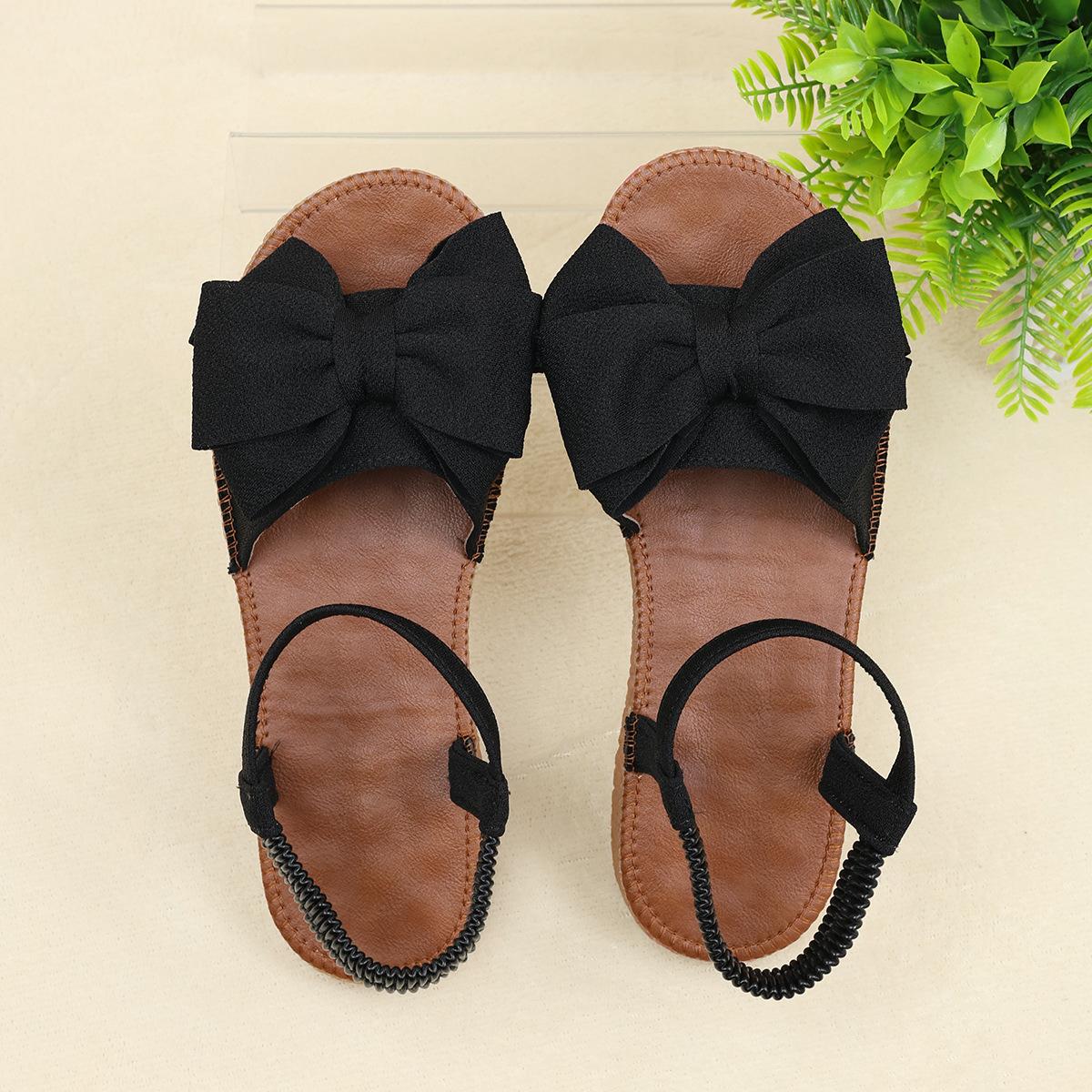 

Женские стильные розовые сандалии на плоской подошве с бантом — легкая повседневная летняя обувь с эластичной резинкой, без застежек и удобной резиновой подошвой 40 чёрный