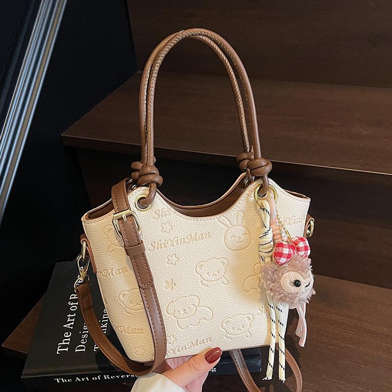 2025 new casual niche cute print high-end portable bucket bag fashionable women's commuter style messenger bag