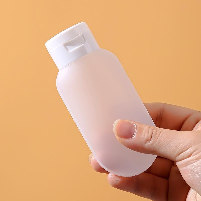 Reiseflaschen mit Shampoo, Duschgel, Reiseartikeln, Hautpflegeprodukten, Kosmetika, tragbaren Proben, leeren Flaschen