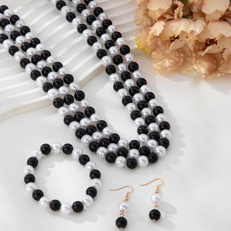 Nuovi Squisiti Design Orecchini, Bracciali, Set Collana con Design Perla Bianca e Nera Lucida