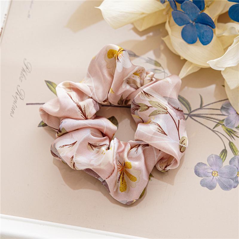 French-style smooth satin scrunchie with floral pattern, versatile elastic hair tie for women, popular on Instagram