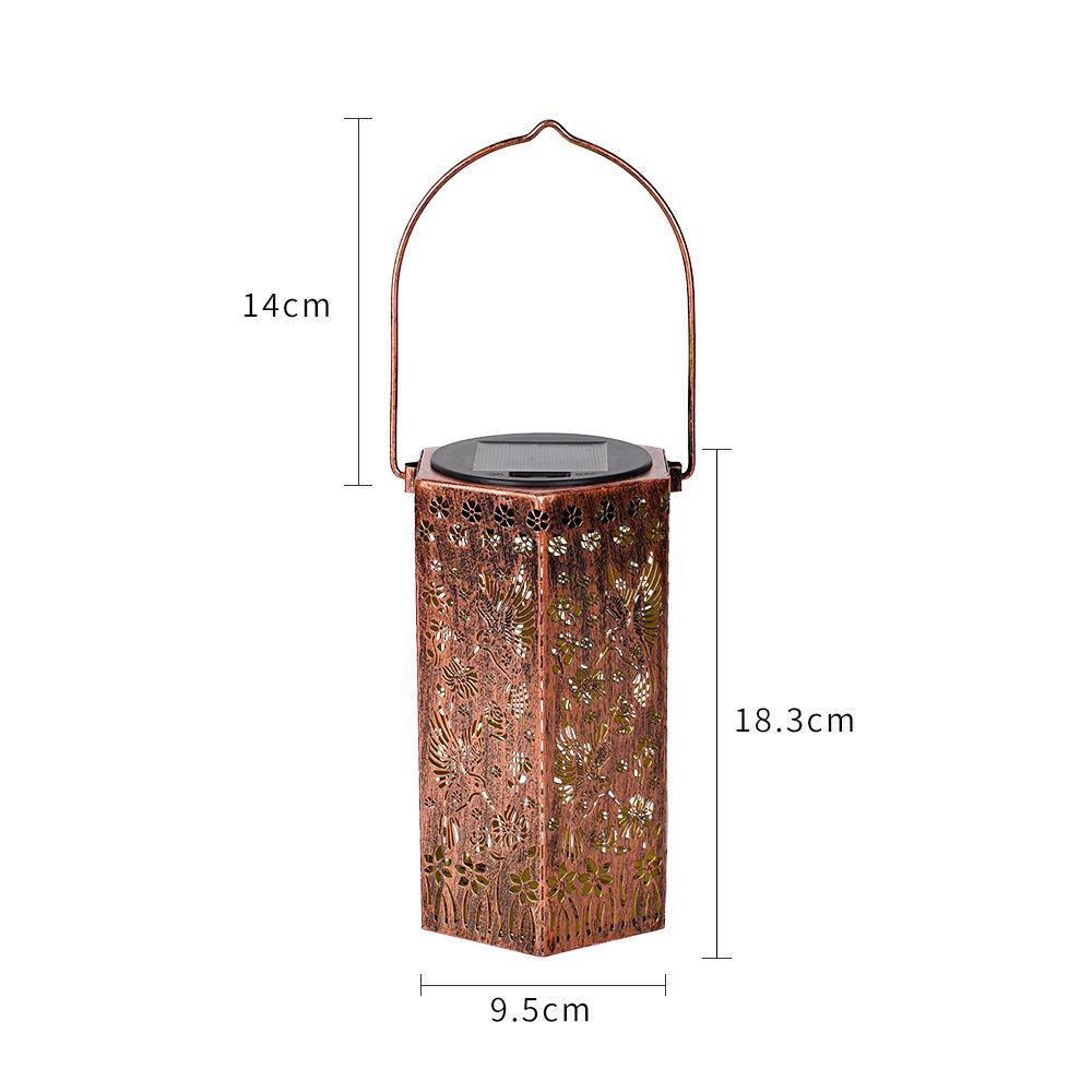 Outdoor Solar Wrought Iron Lantern: Waterproof Hollow Projection Table Lamp for Courtyard and Garden