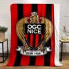 Vertical red and black stripes with an eagle emblem in the center. for all seasons blanket lunch break throw gift