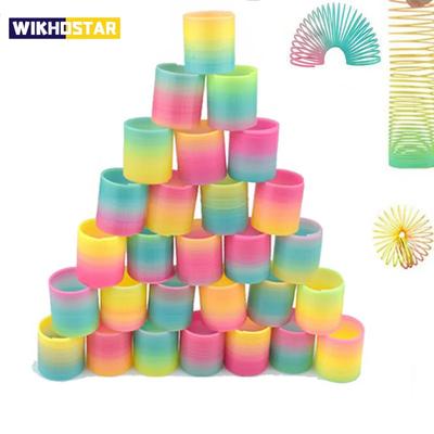 12 ADET Gökkuşağı Sihirli Yaylar Daire Oyuncaklar Çocuklar Doğum Günü Partisi Hediyeleri Misafirler Hediye Küçük Hediyeler Pinata Dolguları Esnek Komik Oyuncak