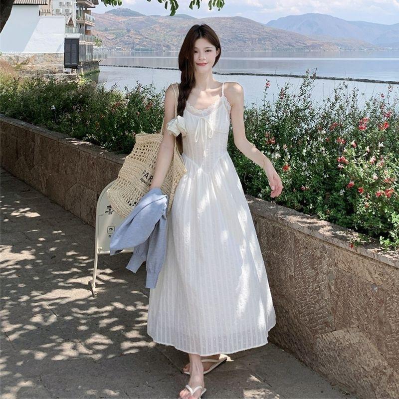 Pure desire wind lotus leaf edge sleeveless floral suspender dress women's summer new waist and thin temperament a word long dress