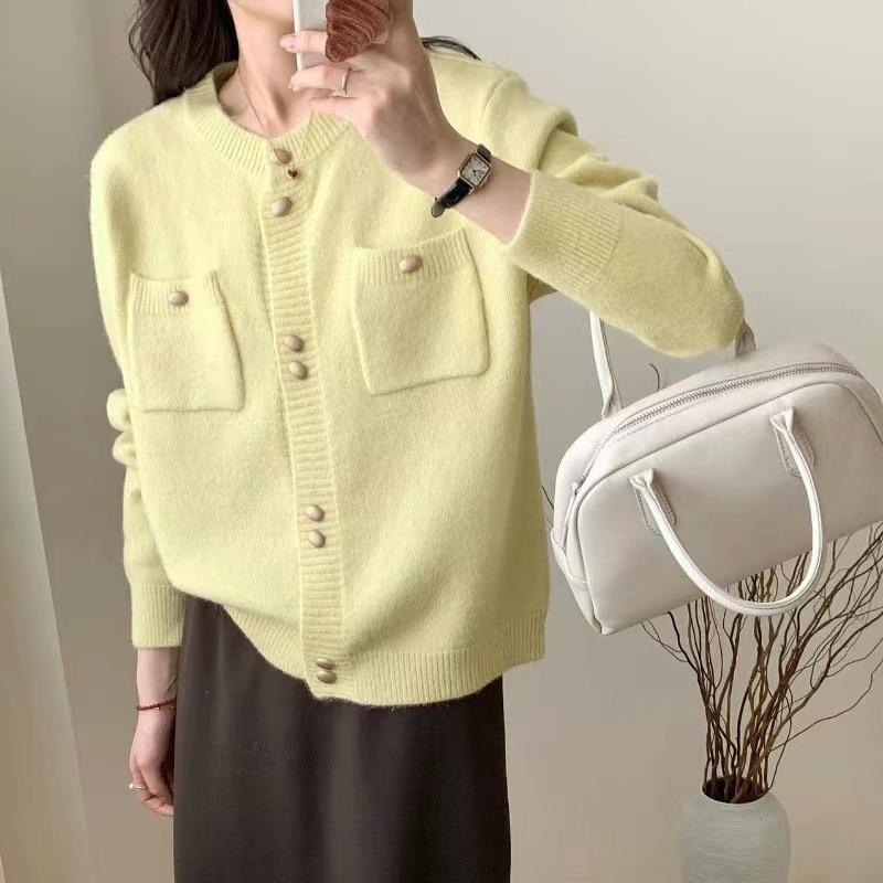 Real autumn and winter new gentle wind double-breasted design sense pocket knitted cardigan women's solid color crew neck sweater jacket