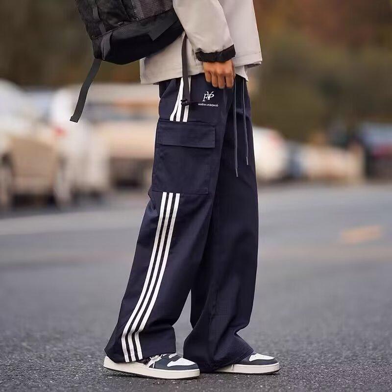 

Мужской полосатый свободный прямой комбинезон - молодежный модный тренд на весну и осень M синий