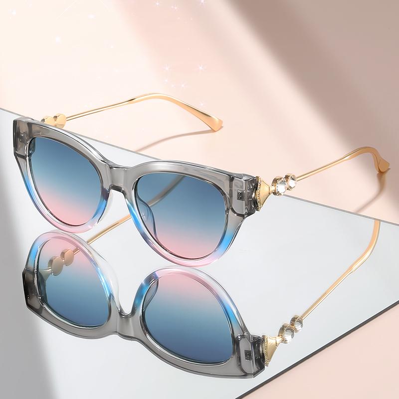 New cat-eye sunglasses with diamond-like embellishments on metal temples for a high-end versatile look